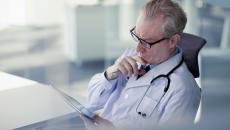 Healthcare provider looking at a tablet